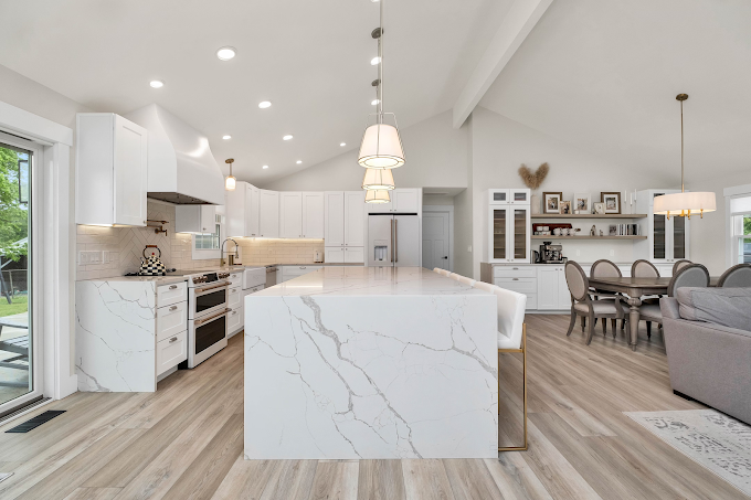 A large kitchen with a center island in the middle of the room